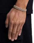 Model wearing 13mm 18K gold ice prong cuban chain set by Iceman Society, side view