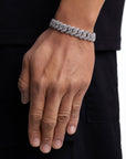 Model wearing 13mm white gold ice prong cuban chain set by Iceman Society, side view