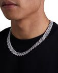 Model wearing 13mm white gold ice prong cuban necklace by Iceman Society, side view