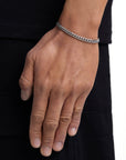 Model wearing 5mm white gold plain cuban bracelet by Iceman Society