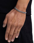 Model wearing 8mm white gold plain cuban chain set by Iceman Society, side view