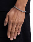 Model wearing 6mm white gold rope chain set by Iceman Society, side view